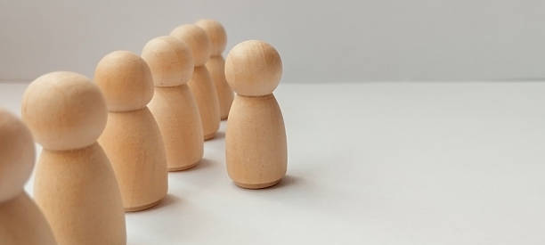 istock Social interaction concept with wooden figures minimalist studio setting conceptual photography 2208911684