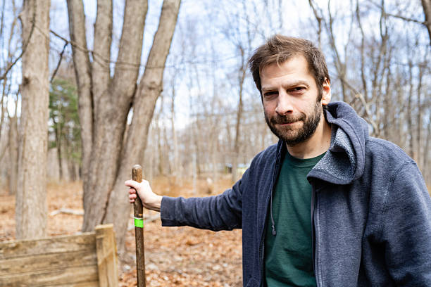 istock Smiling Man With Shovel in Rural New Jersey 2208911913