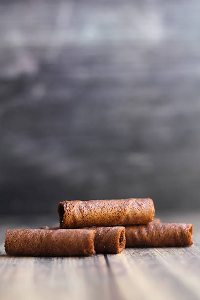 istock chocolate astor snack on a wooden board with a bokeh background 2208912634