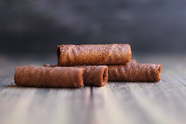 istock chocolate astor snack on a wooden board with a bokeh background 2208912635