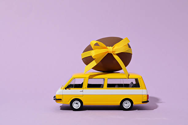 istock A toy car with a chocolate egg 2208914693