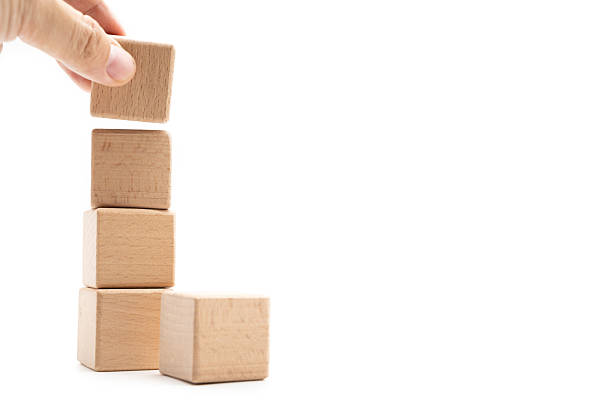istock Hand holding wooden cubes stacked Isolated on white background. Copy Space. Business, Creative or Idea Template. 2208914967