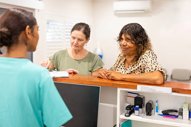 istock Aboriginal nurse at a medical clinic reception 2208914990