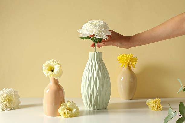 istock Fresh flowers in a vase on a light background. 2208916083