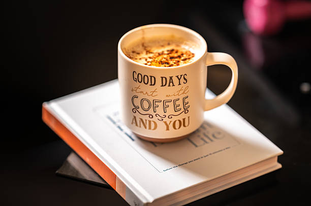 Close up of a cup of coffee with book