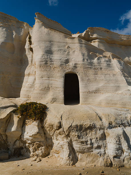 Cave on white Sarakiniko rocks on Milos island, Greece on sunny day