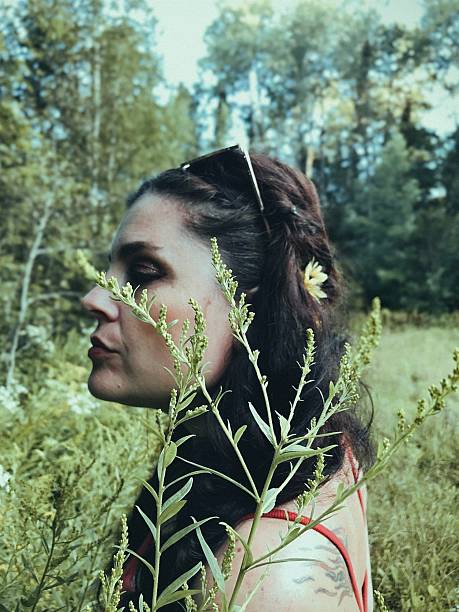 istock Boho Woman in Nature – Soft Focus Portrait with Wild Plants. 2208927077