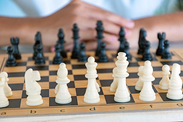 istock Playing chess games on mini wooden chessboard 2208927370