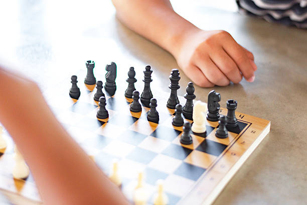 istock Playing chess games on mini wooden chessboard 2208927402