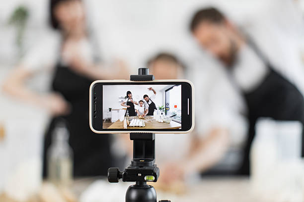 istock Family filmed while baking and dancing together in a home kitchen environment 2208927772