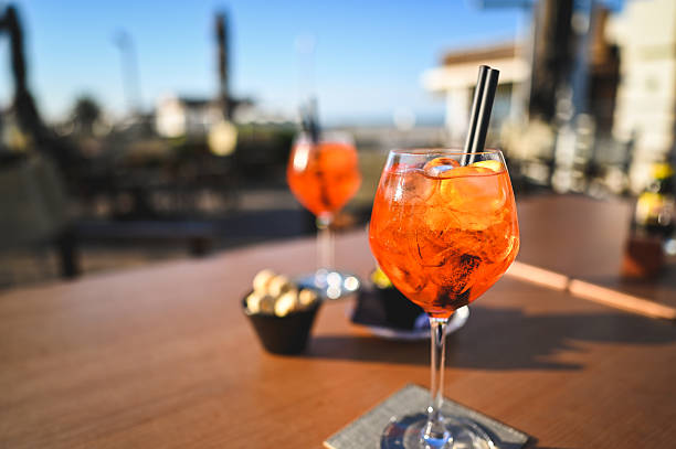 istock Two refreshing Spritz cocktails enjoying the sunset on a terrace table 2208928273