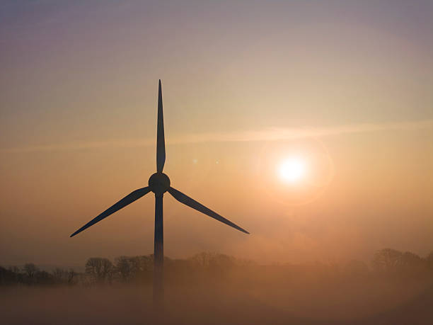 istock Wind Turbines above agricultural fields, sunrise 2208933093