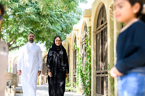 istock Two Muslim parents enjoying a day out with their daughter 2208934366