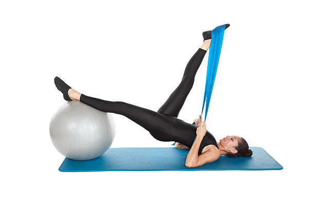 istock hip lift bridge , Stott Pilates approach to original Pilates , core stability, spinal alignment, effective exercise 2208935940