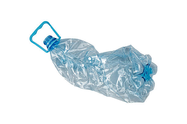 istock Crushed transparent plastic bottle with a blue handle and cap is isolated. Used PET container prepared for recycling. 2208937452