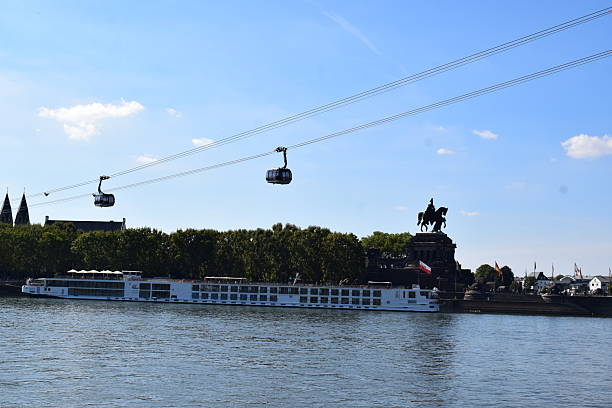 Koblenz, Germany - 09/12/2022: ships below Seilbahn Koblenz with Deutsches Eck in background
