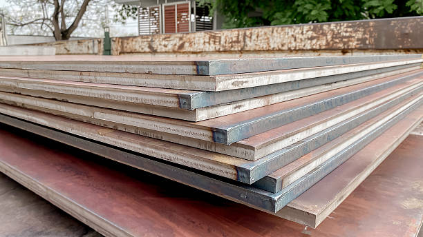 istock Construction Materials Metals black steel sheet, stainless steel sheet stacked arranged in factory.iron steel store in warehouse heavy industry. 2208940822