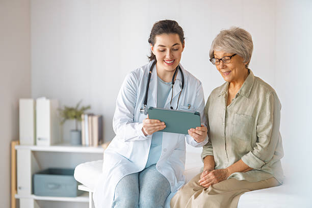 istock patient with a doctor in medical office 2208940892