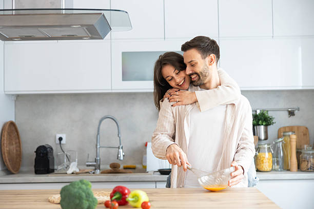 istock Happy Cooking Moment with Couple in Kitchen 2208941661