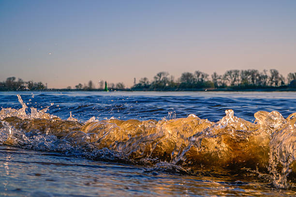 istock Waves charge up to splash against the shore 2208941703