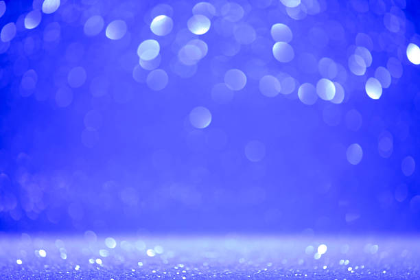 istock Fancy blue glitter sparkle background. Defocused blue color sequin light. Fancy blue color glitter sparkle background. Studio shooting of a creative bright blue color background. It is textured color gradient. There are no text and no people, and have cop 2208943003