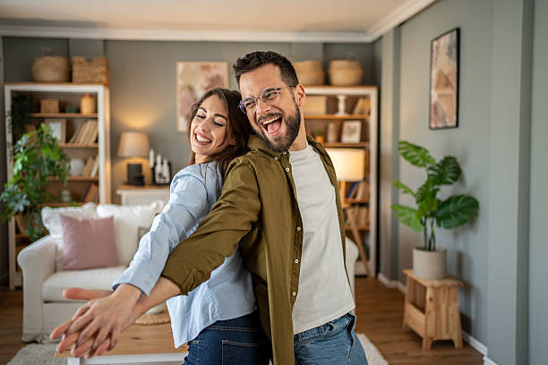 istock Young couple dancing together and having fun at home 2208949684
