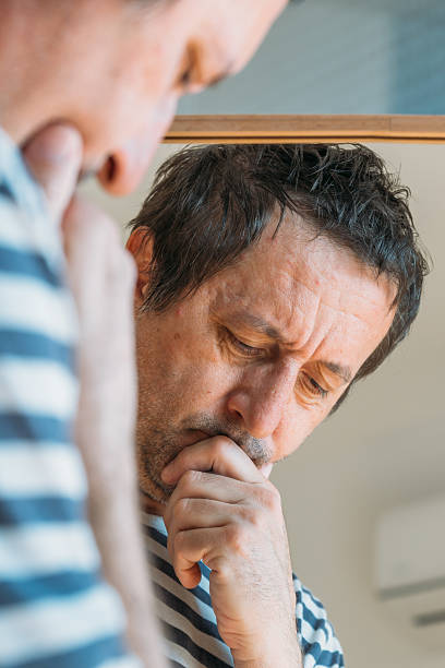 istock Worried concerned man in front of the mirror 2208950396