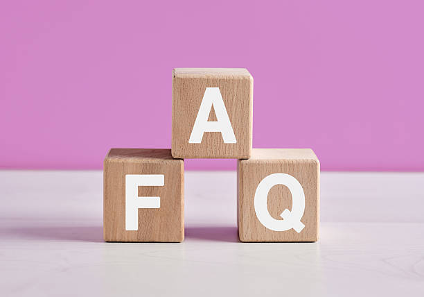 istock Wooden cubes forming the acronym FAQ on a pink background 2208952323