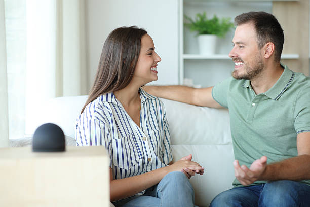 istock Happy couple talking beside a smart speaker 2208955116