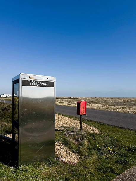 Close up of British red telephone box with crown emblem, Shetland, Scotland