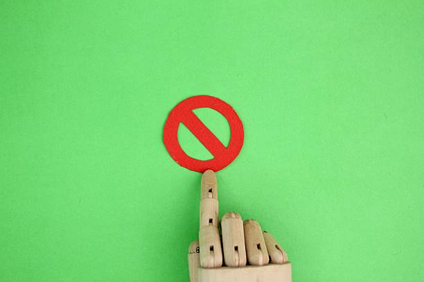 istock wooden hand with forbidden or not allowed sign. concepts are not allowed or prohibited 2208956031