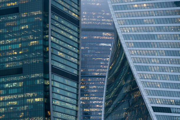 istock Modern glass buildings reflect urban architecture against a cloudy backdrop 2208957763