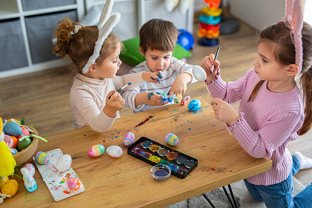istock Little kids painting eggs for Easter holiday 2208960648