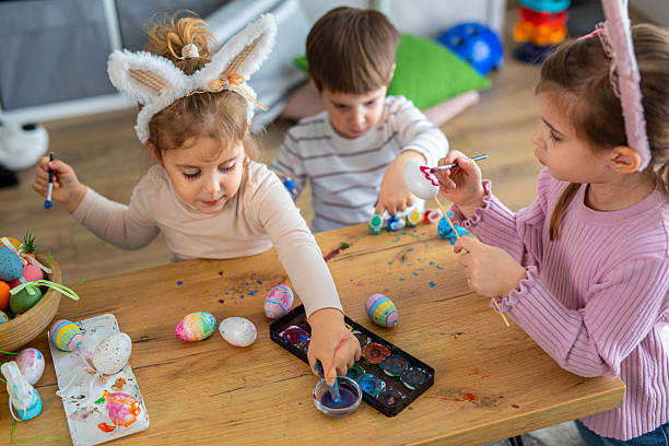 istock Little kids painting eggs for Easter holiday 2208960678