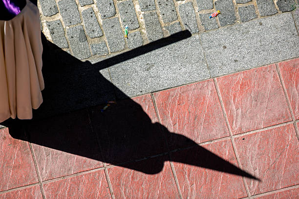 istock Shadow of Penitent During Holy Week Procession in Seville, Spain 2208962844