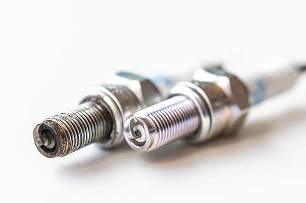 istock New and used spark plugs for cars. 2208963317