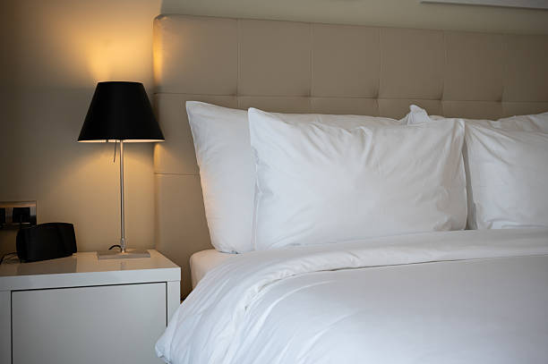 istock Comfortable Hotel Room with Bed and Lamp Lighting Softly 2208963554