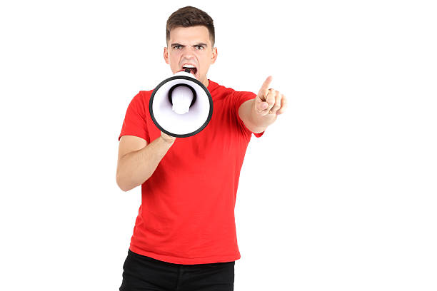 istock Young man screaming in megaphone on white background 2208963649