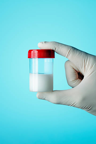 istock healthcare worker holding a container with semen 2208965630