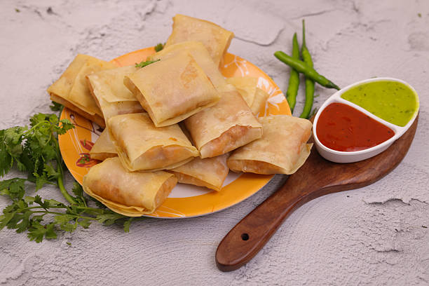 istock Indian Snacks dish with decoration on wooden background creative image 2208965769