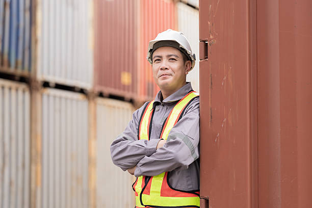 istock Import and export container, Worker inspecting and control of container. Male worker working and managing container at container yard 2208967315