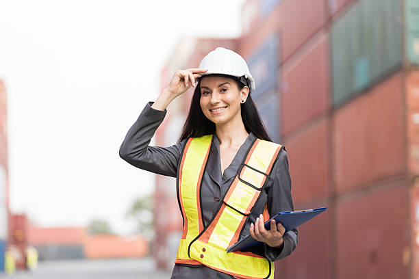 istock Import and export container, Worker inspecting and control of container. Woman worker working and managing container at container yard 2208968908