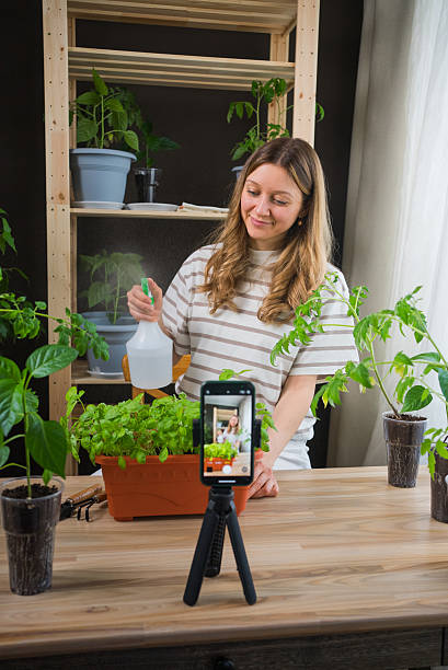 istock Woman Creating a Gardening Tutorial Video on Caring for Potted Plants 2208970763