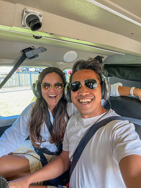 istock Couple Ready for Scenic Flight Adventure in Small Aircraft Cockpit 2208973275