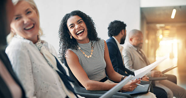 istock Business, laughing and audience in seminar, group and colleagues in workshop for training or meeting. Conference, information and coworkers with notes for presentation, crowd and people in boardroom 2208976837