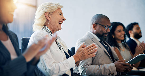 istock Business, applause and group in seminar, celebration and colleagues in workshop for training and meeting. Conference, clapping and happy for achievement in company, crowd and people in boardroom 2208976849