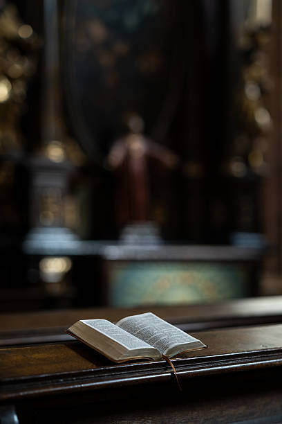 istock Open Bible on Wooden Church Lectern 2208977505