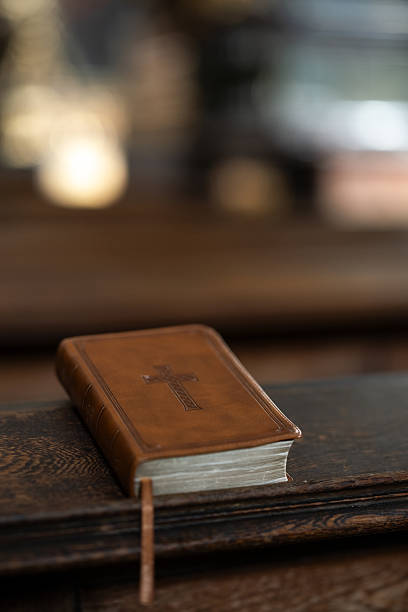 istock Leather Bible on Wooden Pew 2208977543