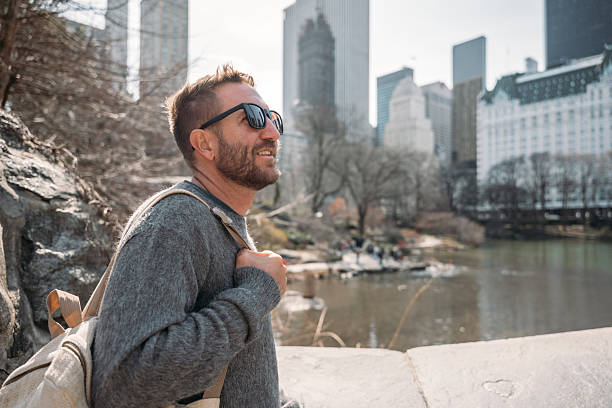 istock Man Enjoying City Skyline View from Park 2208978696