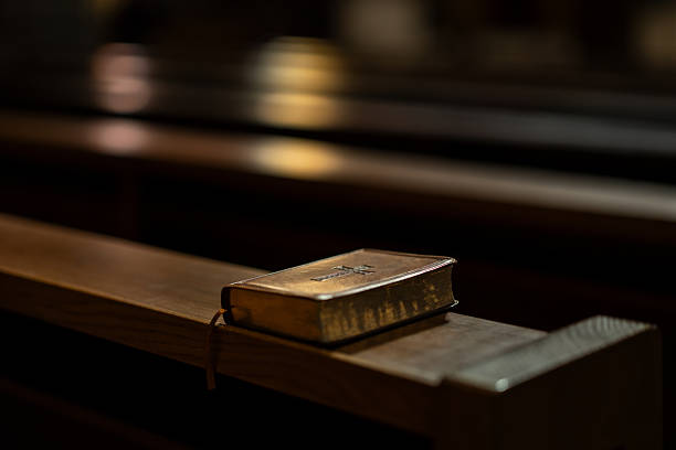 istock Leather Bible on Wooden Pew 2208978874